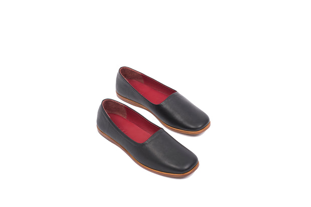 Top view of black flat leather shoes