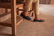 Man wearing navy blue flat leather shoes