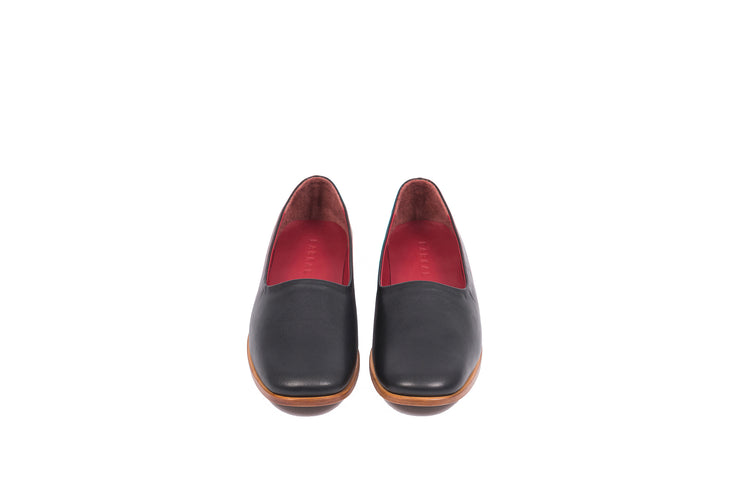 Front view of black flat leather shoes
