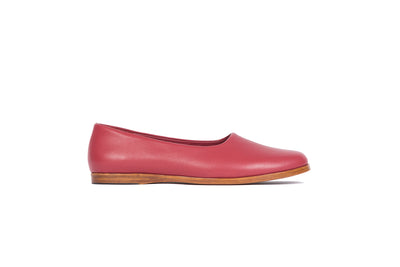 Side view of red flat leather shoes