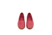 Front view of red flat leather shoes