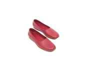 Top view of red flat leather shoes