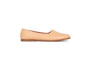 Side view of tan flat leather shoes