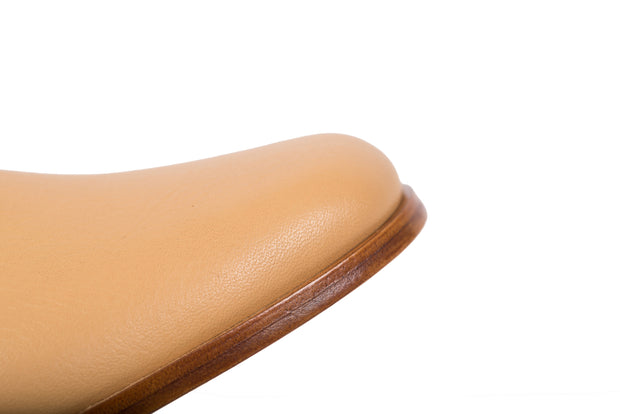 Detail shot of tan flat leather shoes