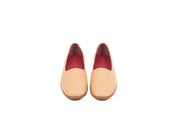 Front view of tan flat leather shoes