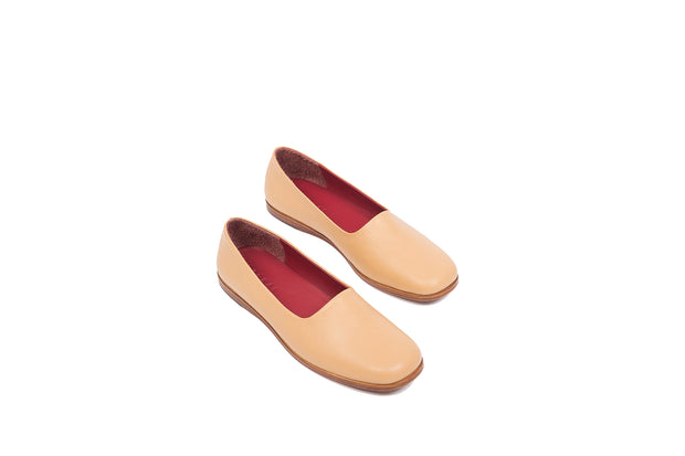 Top view of tan flat leather shoes