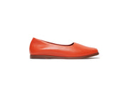 Side view of orange flat leather shoes